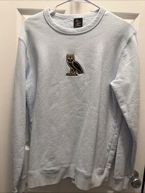 Light Blue Crewneck Sweater with Embroidered Owl Logo